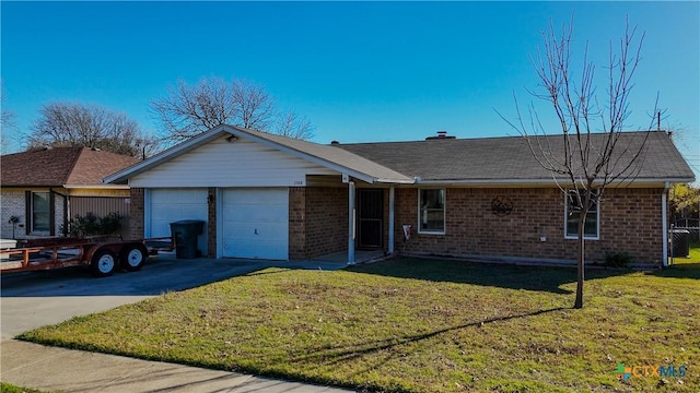 ranch-style home with a garage and a front lawn