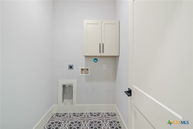 laundry room with cabinets, tile patterned flooring, electric dryer hookup, and hookup for a washing machine