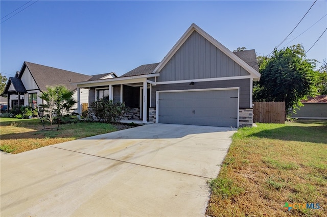 view of front facade featuring a front yard and a garage