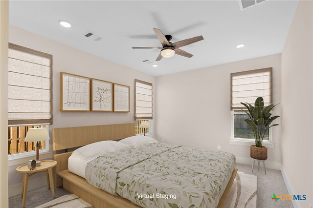 carpeted bedroom featuring ceiling fan