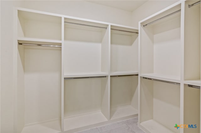 walk in closet featuring light tile patterned floors