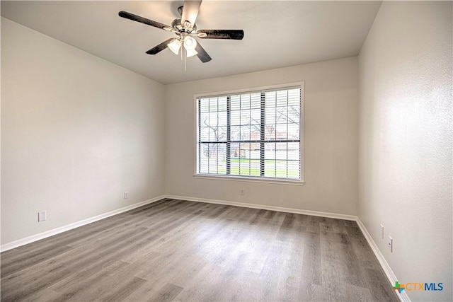 2605 Canyon Creek Dr, Temple, TX 76502 - spare room featuring wood finished floors, baseboards, and ceiling fan