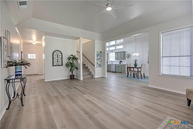 2605 Canyon Creek Dr, Temple, TX 76502 - living area featuring ceiling fan, stairs, light wood finished floors, and baseboards