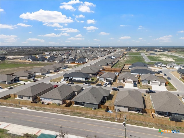 birds eye view of property with a residential view