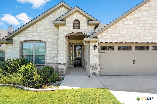 exterior space with a garage and a yard