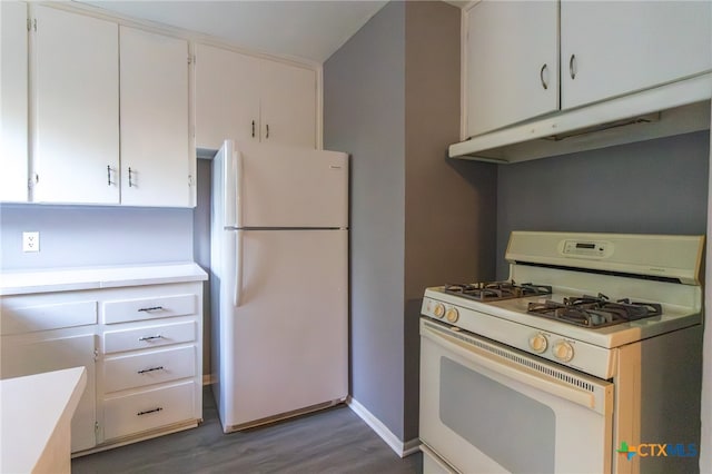 kitchen featuring white cabinets, dark hardwood / wood-style floors, and white appliances