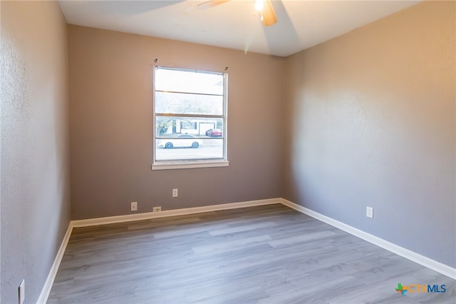 unfurnished room featuring wood-type flooring and ceiling fan