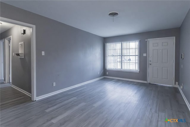 interior space with dark hardwood / wood-style flooring