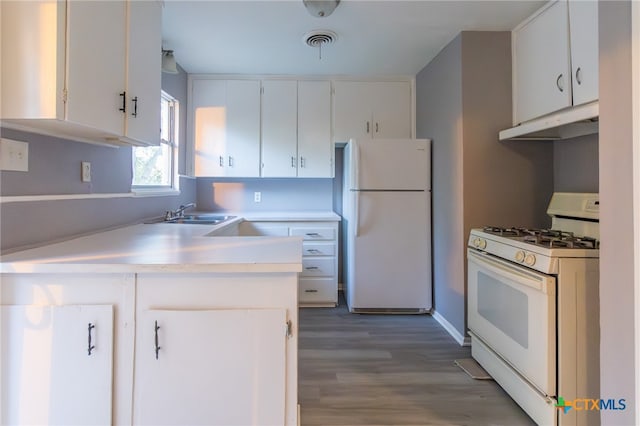 kitchen with white cabinets, white appliances, hardwood / wood-style flooring, and sink