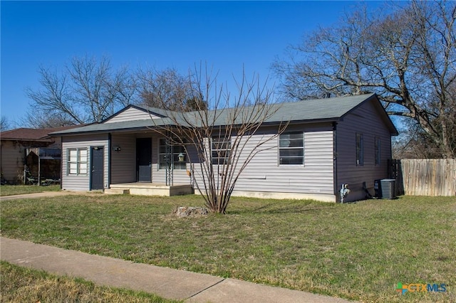 view of front of house featuring a front yard and central AC unit