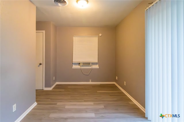 unfurnished room featuring light wood-type flooring