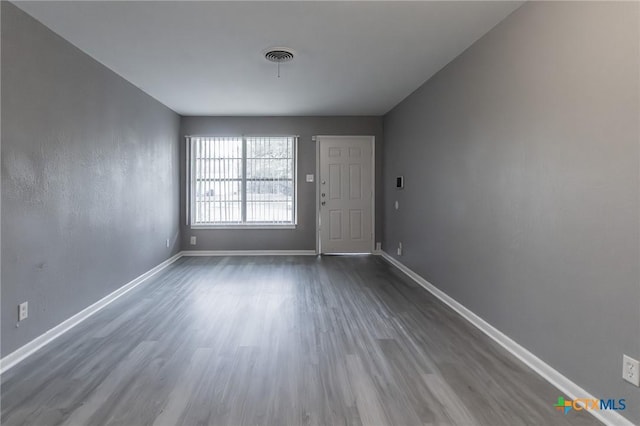 empty room featuring hardwood / wood-style flooring