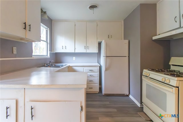 kitchen featuring white appliances, dark wood-type flooring, sink, white cabinetry, and range hood