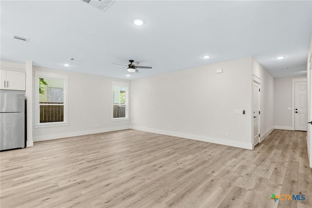505 E Convent St, Victoria, TX 77901 - unfurnished living room featuring a ceiling fan, light wood-type flooring, recessed lighting, and baseboards