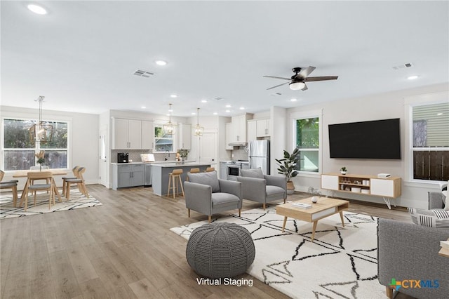 505 E Convent St, Victoria, TX 77901 - living room with plenty of natural light, light wood-style flooring, ceiling fan, and recessed lighting