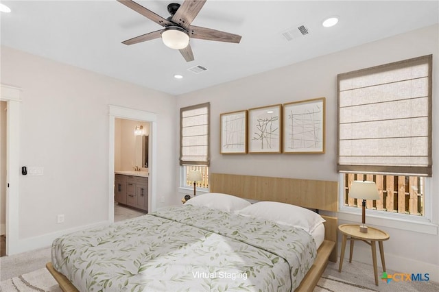 505 E Convent St, Victoria, TX 77901 - bedroom featuring light carpet, baseboards, recessed lighting, connected bathroom, and ceiling fan
