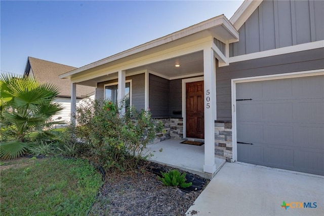 505 E Convent St, Victoria, TX 77901 - property entrance featuring board and batten siding, stone siding, and covered porch