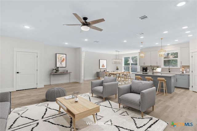 505 E Convent St, Victoria, TX 77901 - living area featuring ceiling fan, recessed lighting, light wood finished floors, and baseboards