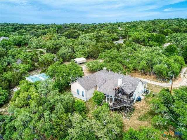 bird's eye view featuring a wooded view