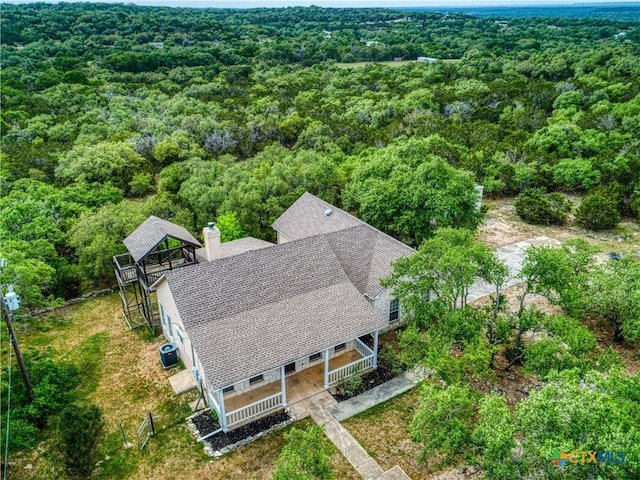 aerial view featuring a forest view