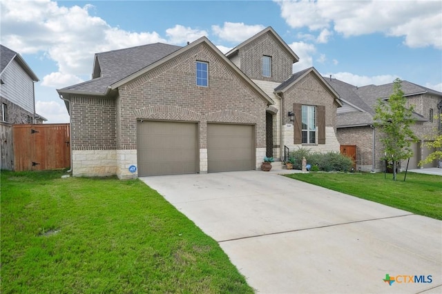 view of front of property featuring a garage and a front yard