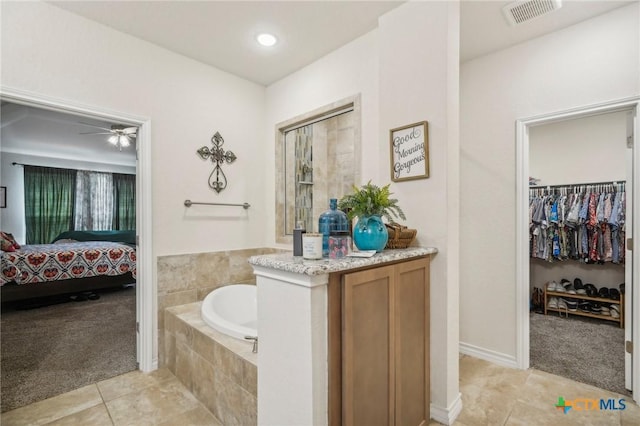1640 Buckner Pl, San Antonio, TX 78253 - bathroom featuring a relaxing tiled tub and tile patterned floors