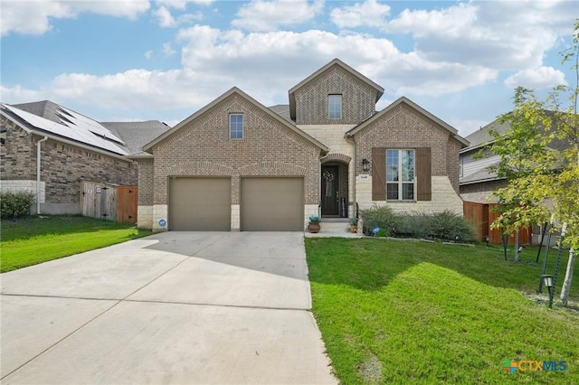 view of front of home with a garage and a front yard