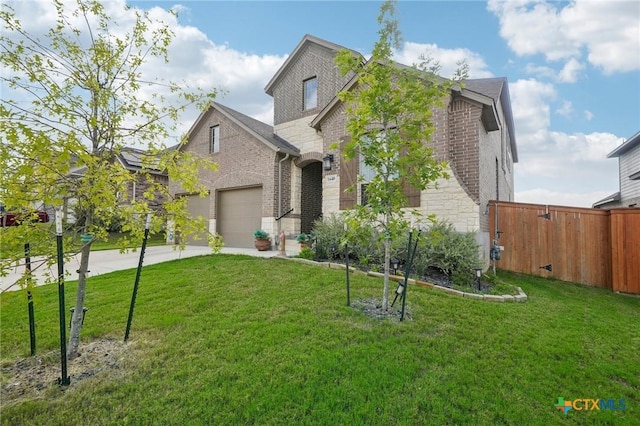 view of front of house featuring a garage and a front lawn