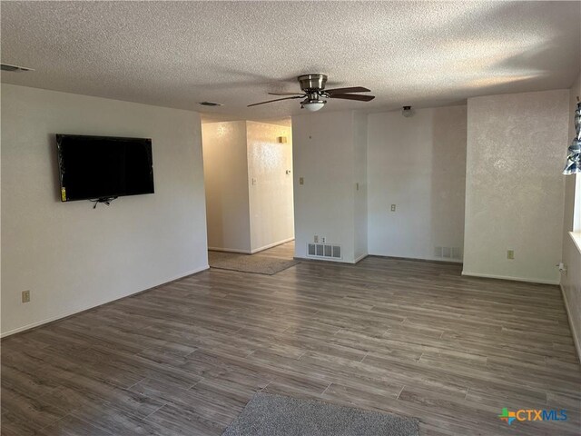 908 Randa St, Copperas Cove, TX 76522 - unfurnished living room featuring a ceiling fan, a textured ceiling, visible vents, and wood finished floors