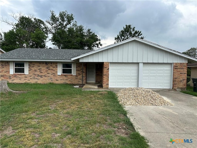 single story home featuring driveway, brick siding, a front lawn, an attached garage, and a shingled roof