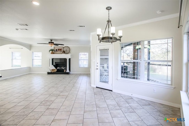 unfurnished living room featuring visible vents, a fireplace with raised hearth, and ornamental molding