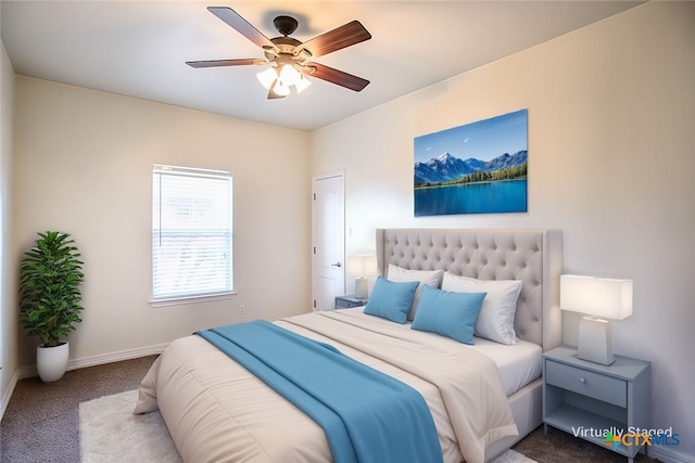 bedroom with ceiling fan, baseboards, and carpet flooring