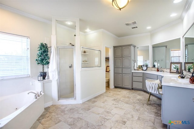 full bathroom featuring a stall shower, visible vents, a garden tub, crown molding, and vanity