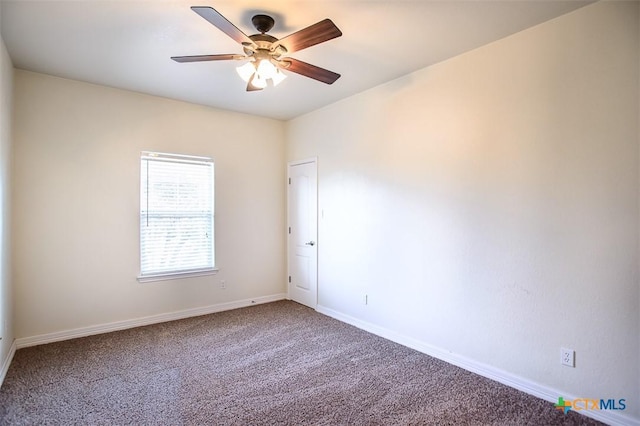 unfurnished room featuring baseboards, a ceiling fan, and carpet flooring