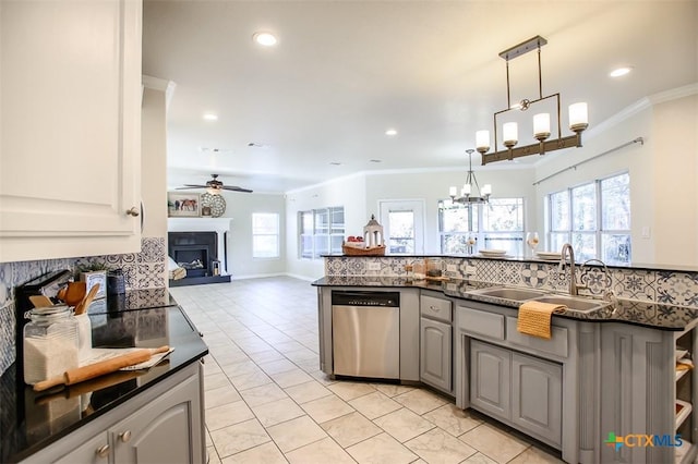 kitchen with dark countertops, dishwasher, and gray cabinetry