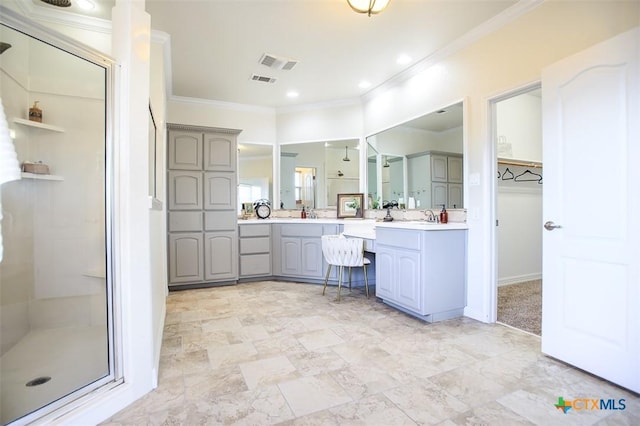 full bathroom featuring a closet, visible vents, ornamental molding, a stall shower, and vanity