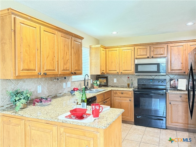 3434 Horizon St, Copperas Cove, TX 76522 - kitchen with light countertops, plenty of natural light, a sink, and black appliances