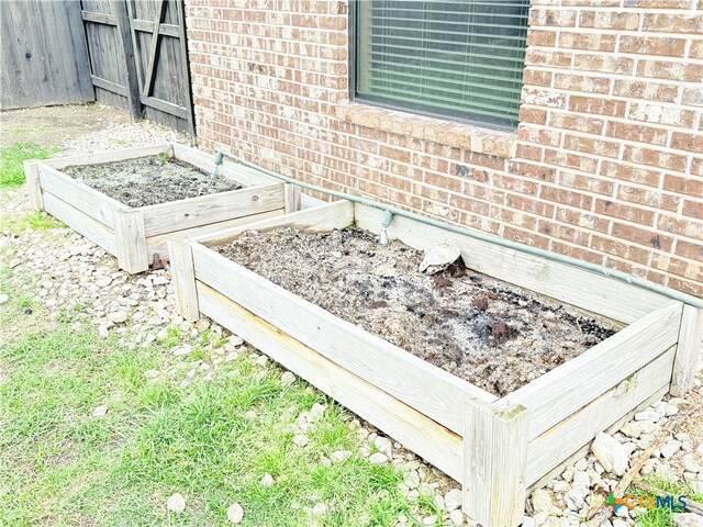 3434 Horizon St, Copperas Cove, TX 76522 - exterior details with brick siding and a garden