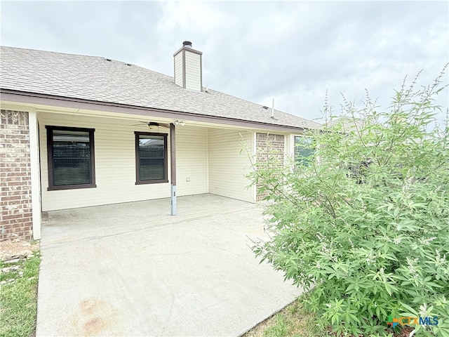 3434 Horizon St, Copperas Cove, TX 76522 - back of house with a patio, a shingled roof, a chimney, and brick siding