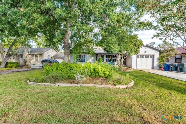 view of front facade with a front lawn and a garage