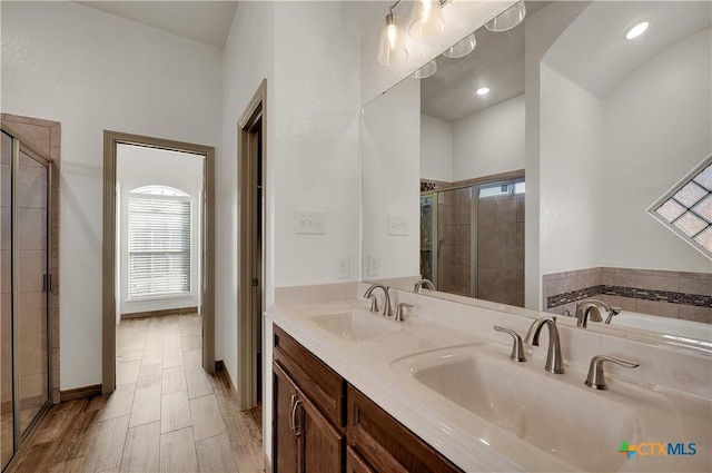 bathroom with vanity and independent shower and bath