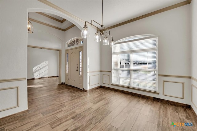 interior space featuring hardwood / wood-style floors and ornamental molding