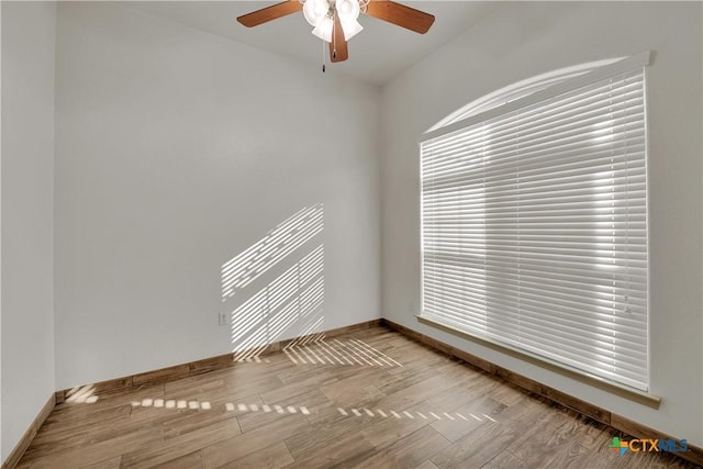 spare room featuring ceiling fan and light hardwood / wood-style floors