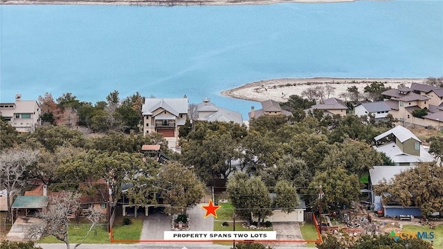 birds eye view of property with a water view