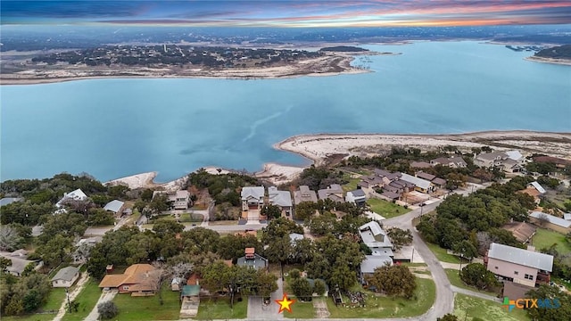 aerial view at dusk with a water view