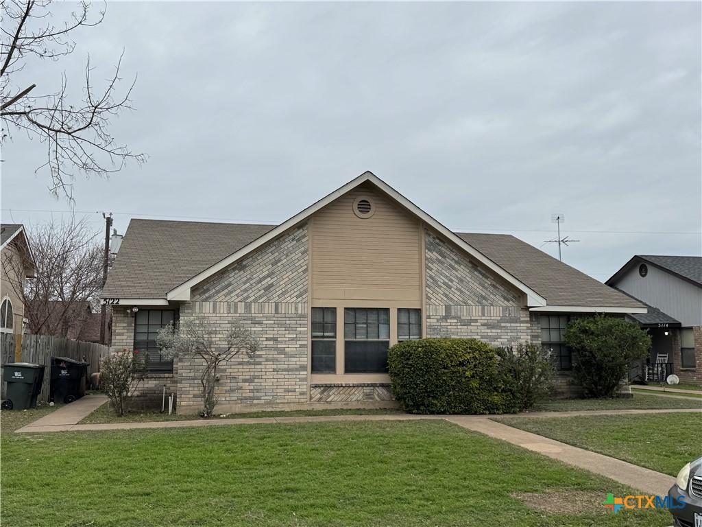 exterior space featuring a front lawn