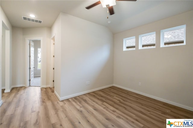 unfurnished room featuring light wood-type flooring and ceiling fan