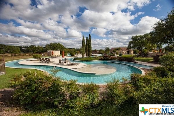 view of pool featuring a patio