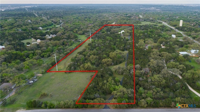 1660 W Mccarty Ln, San Marcos, TX 78666 - aerial overview of property's location featuring property parcel outlined and a heavily wooded area