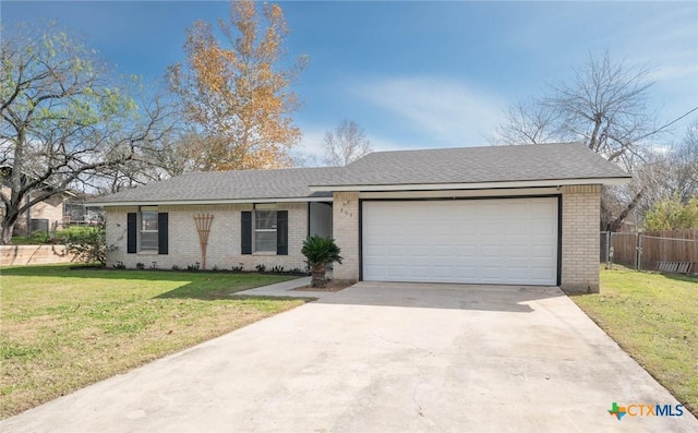 ranch-style house with a front lawn and a garage